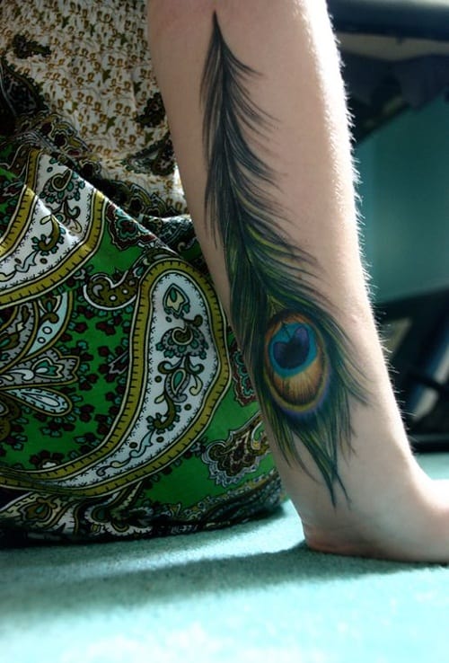 Symbolic Peacock Tattoo On Arm