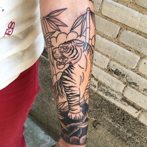 black tiger tattoo on arm