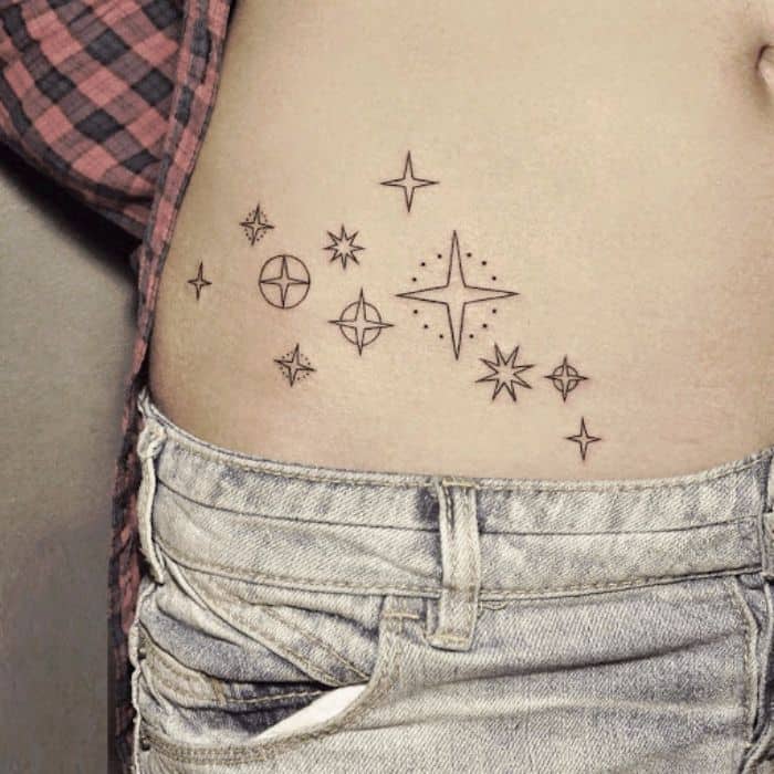 assorted star tattoo on stomach. 
