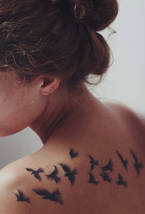 flying birds tattoo on back