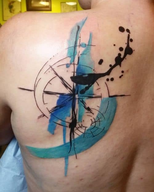 Compass Tattoo with Blue and Black Splashes on Back