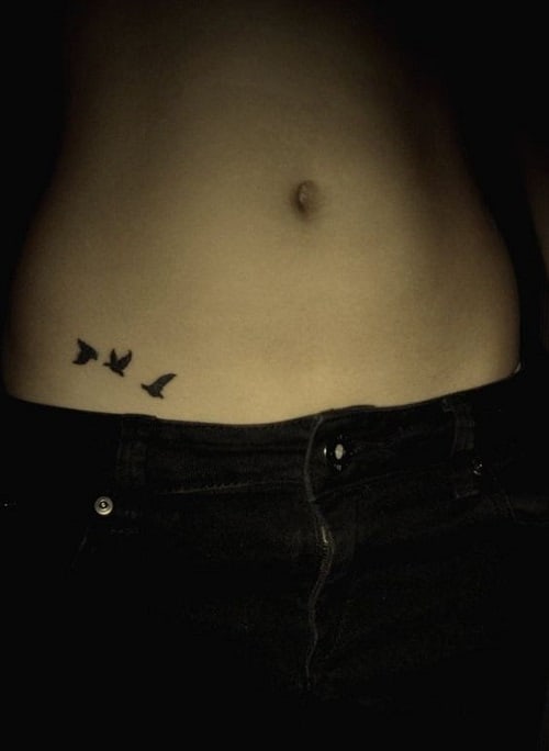 Small Bird Tattoo on Lower Abdomen