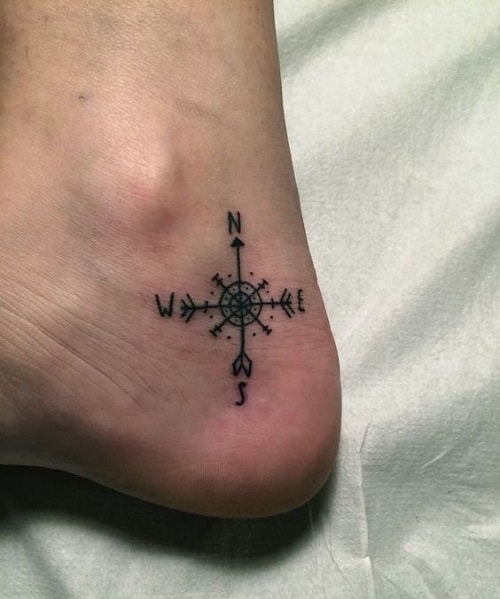 Minimal compass tattoo on the ankle - Tattoogrid.net