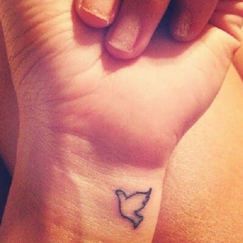 Tiny Bird Tattoo on Wrist