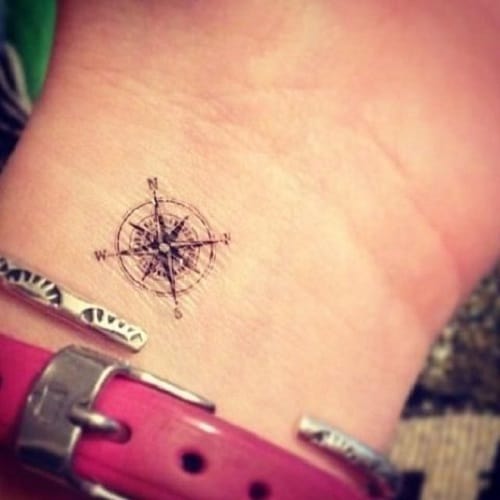 tiny compass tattoo on wrist