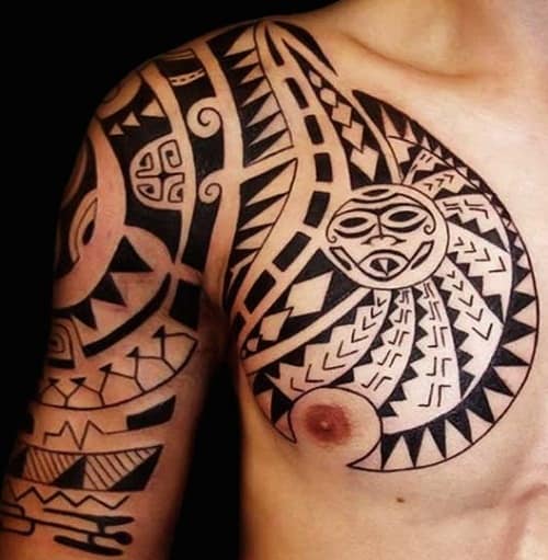 tribal tattoos on arm and chest