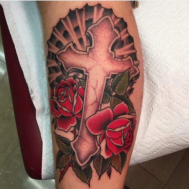 cross tattoo with flowers