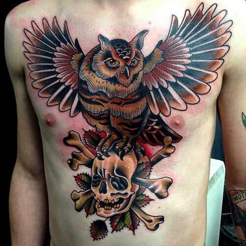 Owl on Chest Standing on a Skull Tattoo