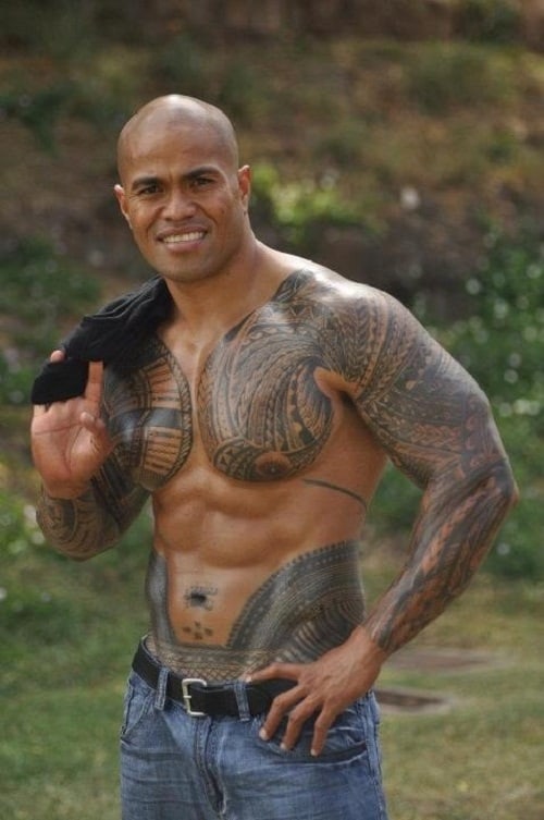 Samoan Man Tribal Tattoos. tribal tattoo on chest and arm. 