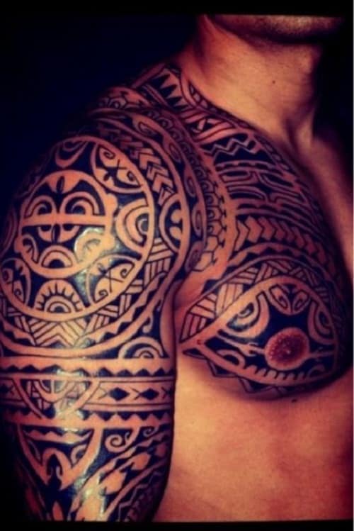 tribal tattoos on arm shoulder and chest