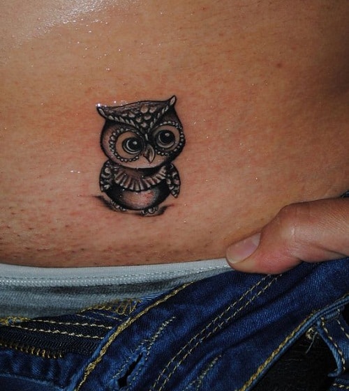 Owl tattoo on the ankle.