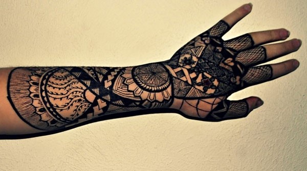 black polynesian tattoo on arm