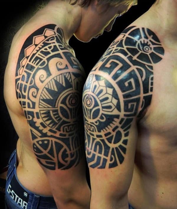 two maori shoulder tattoos