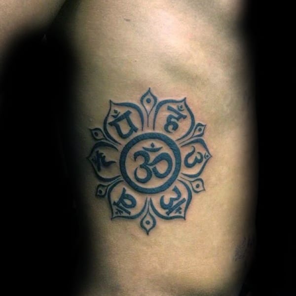 Male With Om Flower Tattoo On Rib Cage Side Of Body