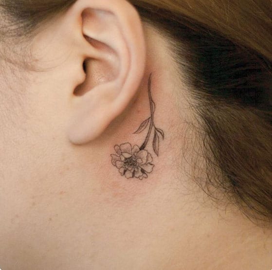 Inverted Flower Behind The Ear Tattoo by River