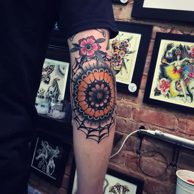 Colorful traditional floral elbow tattoo  Tattoogridnet