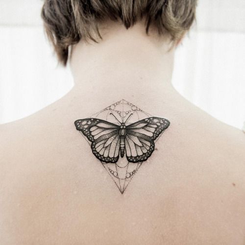 Black Butterfly with Geometric Lines on Back Tattoo