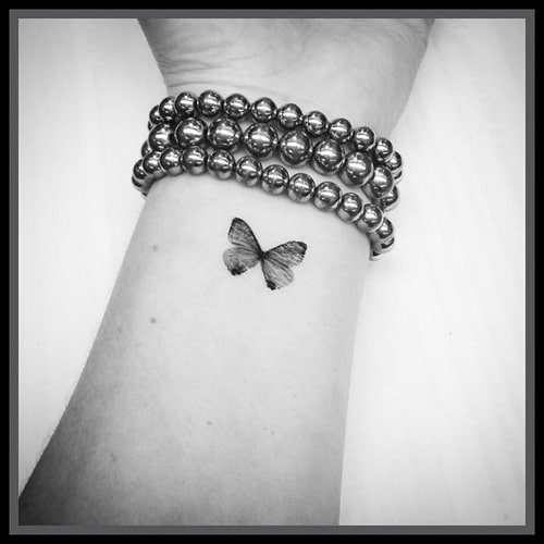 Black Wrist Butterfly Tattoo