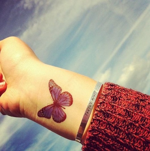 Blue Butterfly on Wrist Tattoo