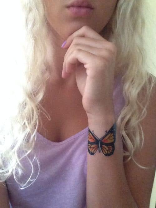 Small Butterfly on Arm Tattoo