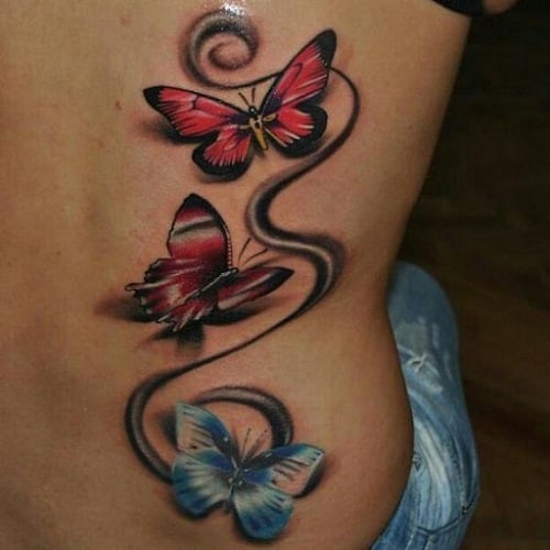 Three Small Butterflies with Swirls Tattoo