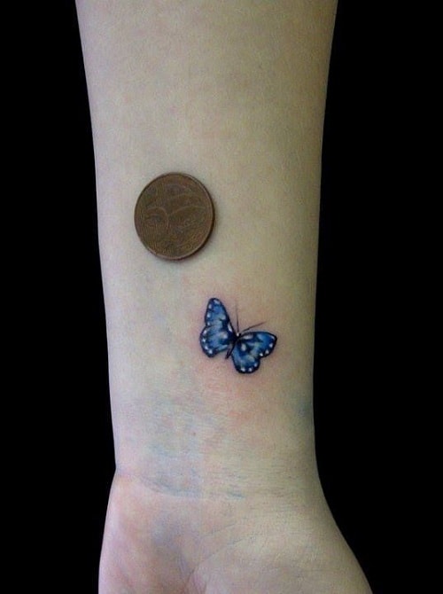 Tiny Blue Butterfly on Wrist Tattoo
