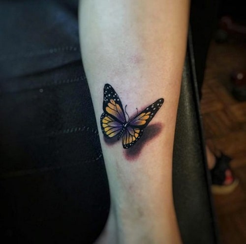 Yellow and Black with a Touch of Violet Butterfly Arm Tattoo