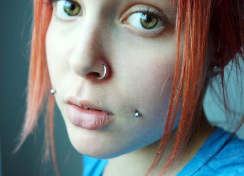 Left Nostril And Silver Studs Cheek Piercing