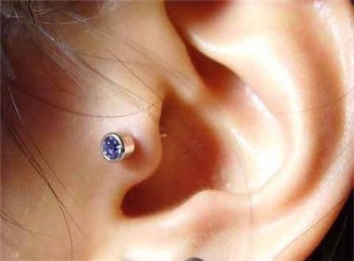 tragus piercing of blue stud