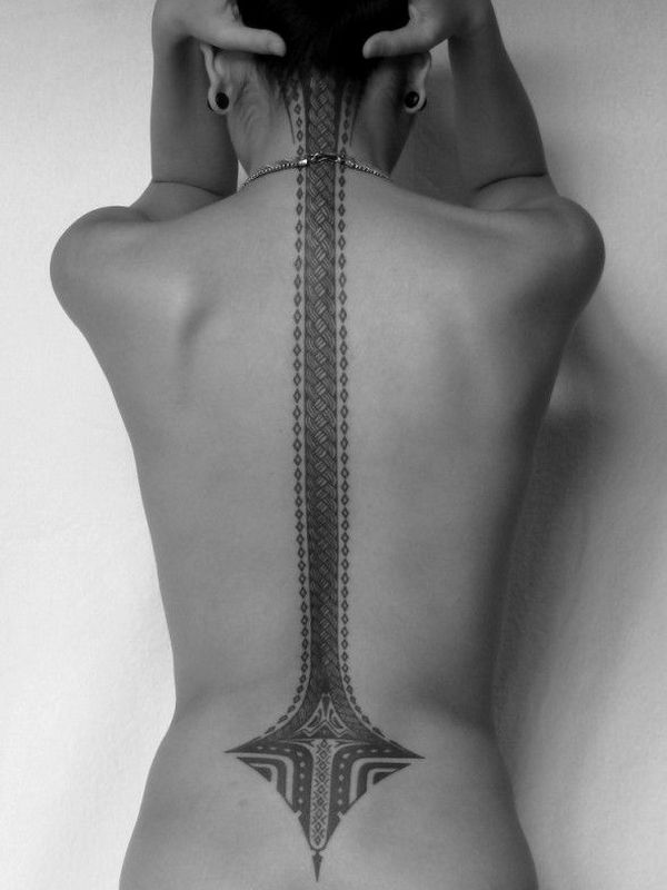 black and white spine tattoo