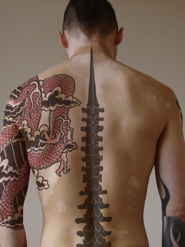 men spine tattoo