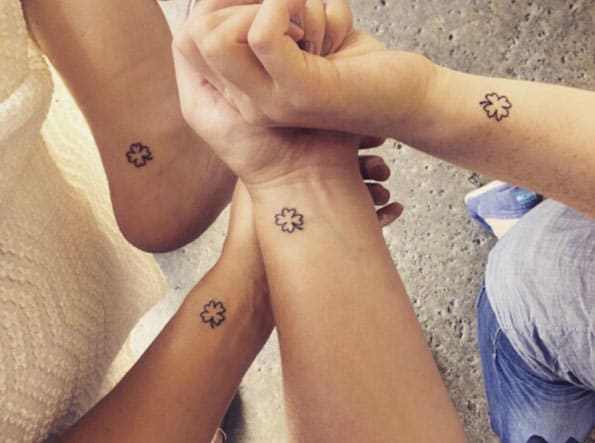 Matching hearts tattoo for sisters, minimalistic style.