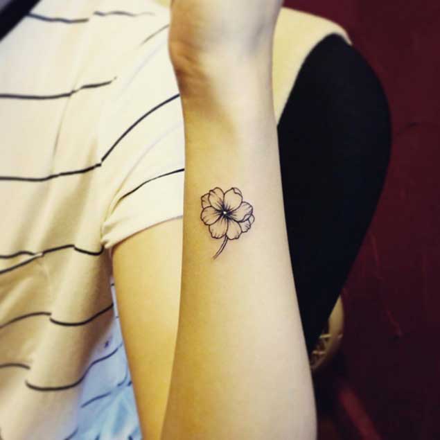 Tiny Flower Tattoo on Wrist