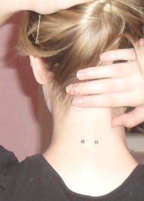 Girl Showing Her Surface Nape Piercing Picture