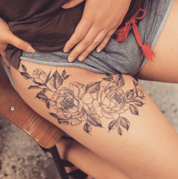 flower tattoo on thigh