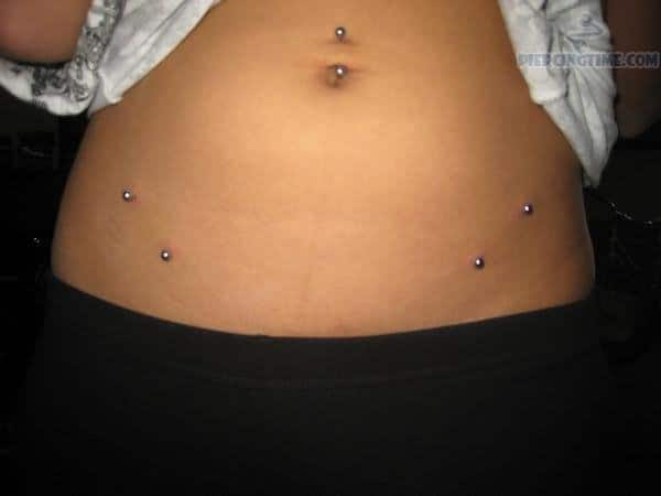 Belly Button And Hip Piercing With Surface Barbell