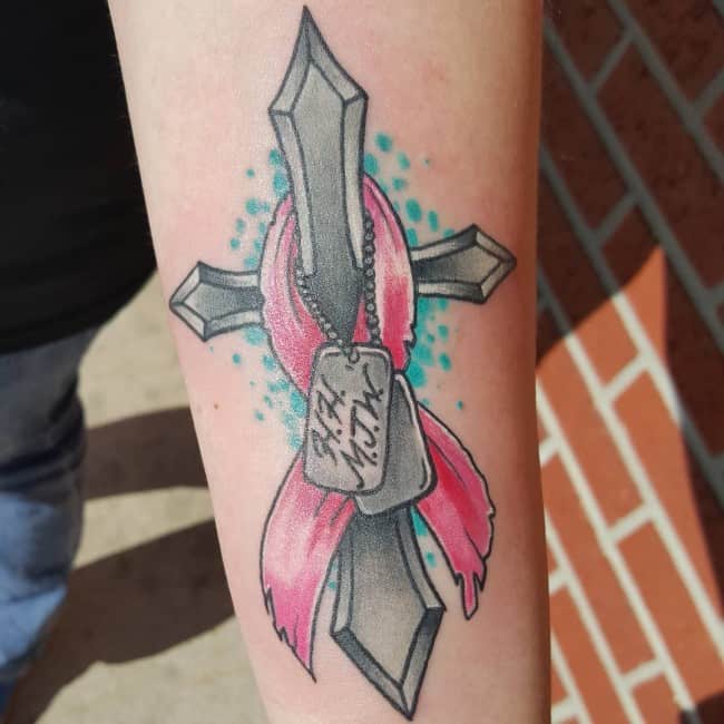 ribbon tattoo on arm. ribbon with cross tattoo on arm. cancer-ribbon-...