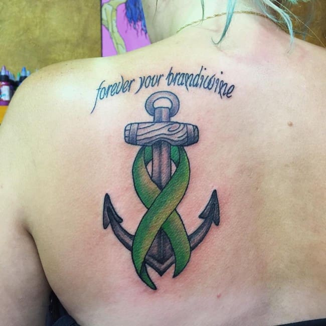 cancer ribbon tattoo on back