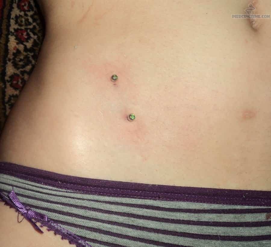 Hip Piercings With Green Gems
