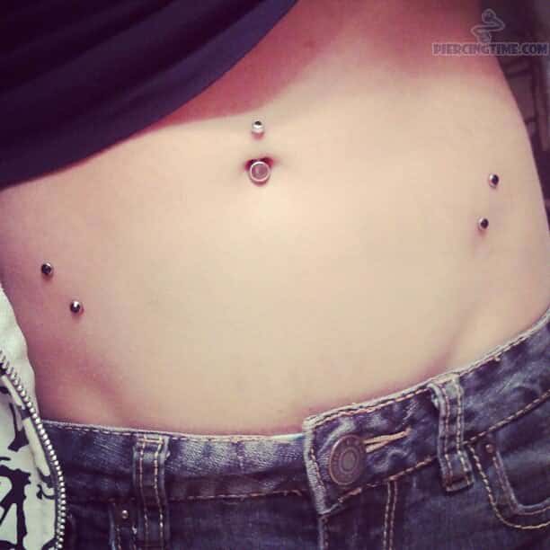 Surface Hip Piercings With Gems And Belly Button Piercing