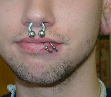 Extreme Septum And Spider Bite Piercing For Men