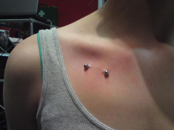 Silver Barbell Collar Bone Piercing On Right Side