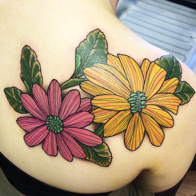daisy tattoo on shoulder