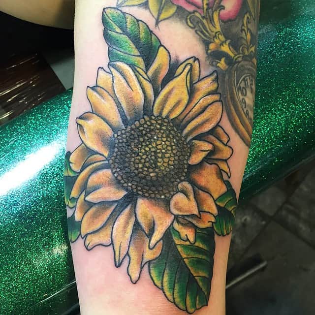 Sunflower tattoo on the inner arm