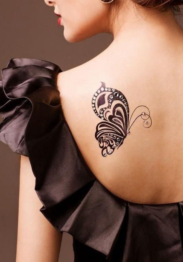 butterfly tattoo on back of lady