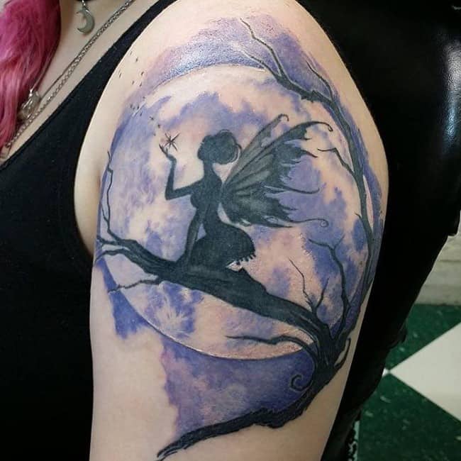 black fairy tattoo on arm. fairy tattoo 22. 