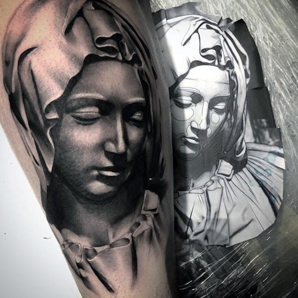 guy-with-christian-symbol-tattoo-of-mother-mary