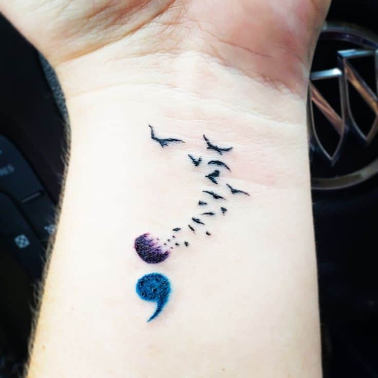 bird semicolon tattoo on wrist