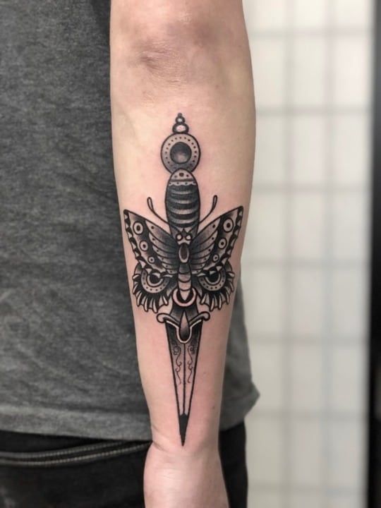 butterfly knife tattoo on arm