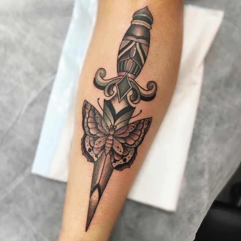 butterfly knife tattoo on arm